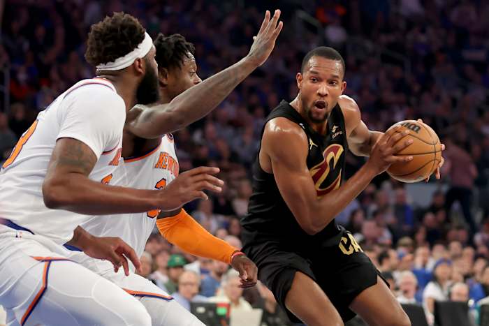 Apr 21, 2023; New York, New York, USA; Cleveland Cavaliers forward Evan Mobley (4) drives to the basket against New York Knicks center Mitchell Robinson (23) and forward Julius Randle (30) during the first quarter of game three of the 2023 NBA playoffs at Madison Square Garden.